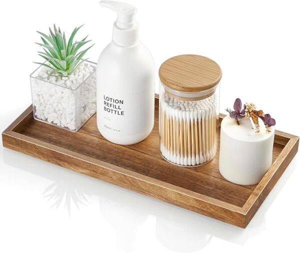 ALELION 11.7" acacia wood vanity tray on bathroom counter holding perfume, soap dispenser, and decor items – ideal for toilet tank or kitchen countertop use. Image source from Amazon